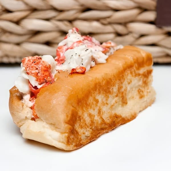 A Maine-ly Sandwiches lobster roll, featuring generous chunks of lobster meat in a toasted bun.
