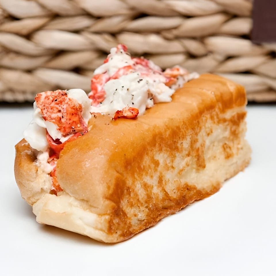 A Maine-ly Sandwiches lobster roll, featuring generous chunks of lobster meat in a toasted bun.